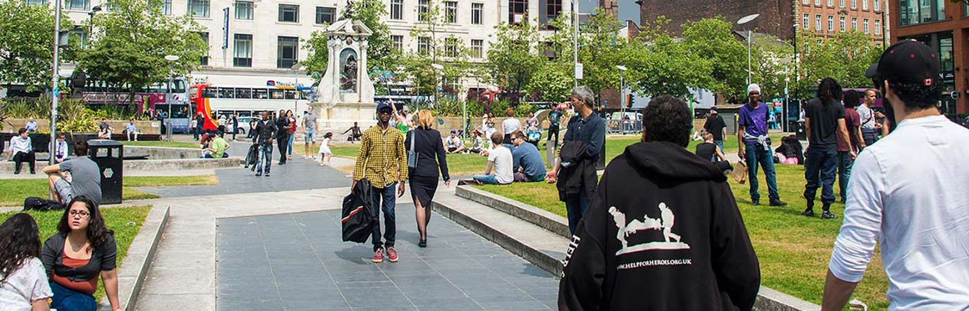 people in Manchester Piccadilly Gardens