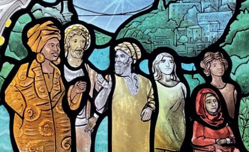 stained glass window at St Mary Redcliffe church, Bristol, showing diverse group of neighbours
